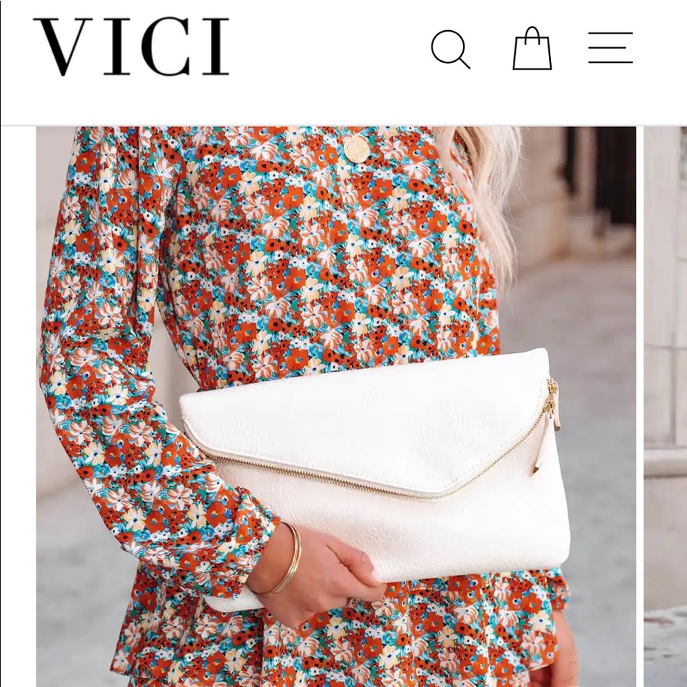 Brand new Vici crossbody clutch. Pearled white. Still in packaging
